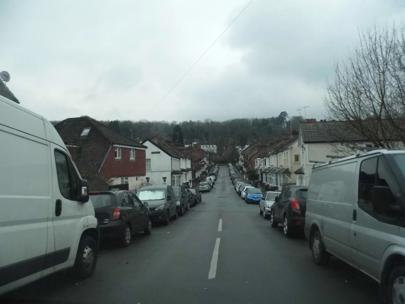 Sunnydene Road, Purley, a street of terraced houses with cars parked along both sides.