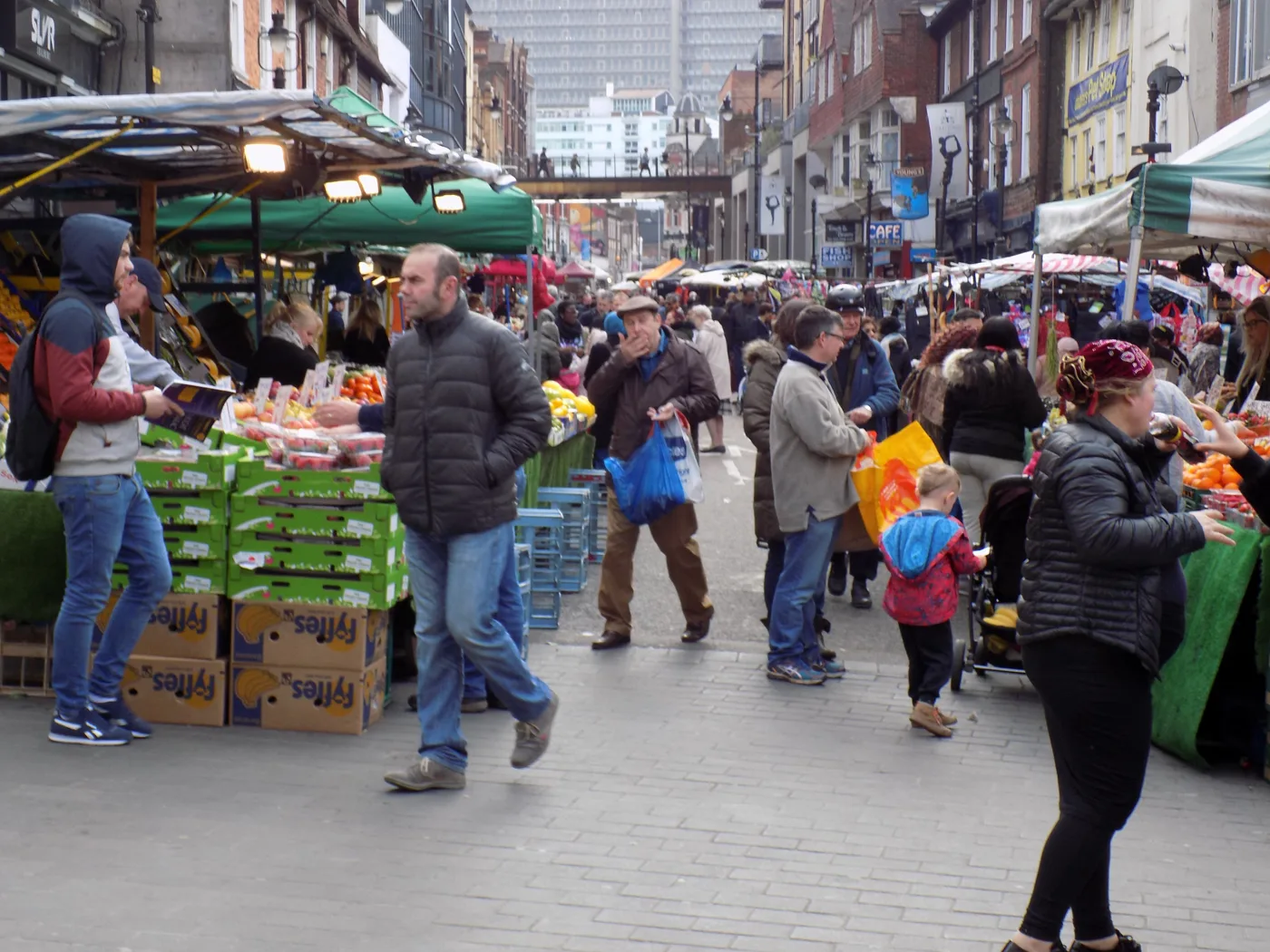 Shoppers between the stalls on Surrey Street Market, Croydon